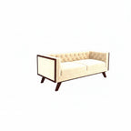 Homecrest Sturton velvet Chesterfield sofa in a light beige hue with tufted backrest and dark wooden frame accents.