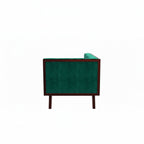 Homecrest Sturton Chesterfield sofa in emerald green velvet with a dark wood frame, side view showing armrest detail.