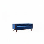 Homecrest Sturton velvet Chesterfield sofa in deep indigo blue with a rectangular frame and tufted backrest