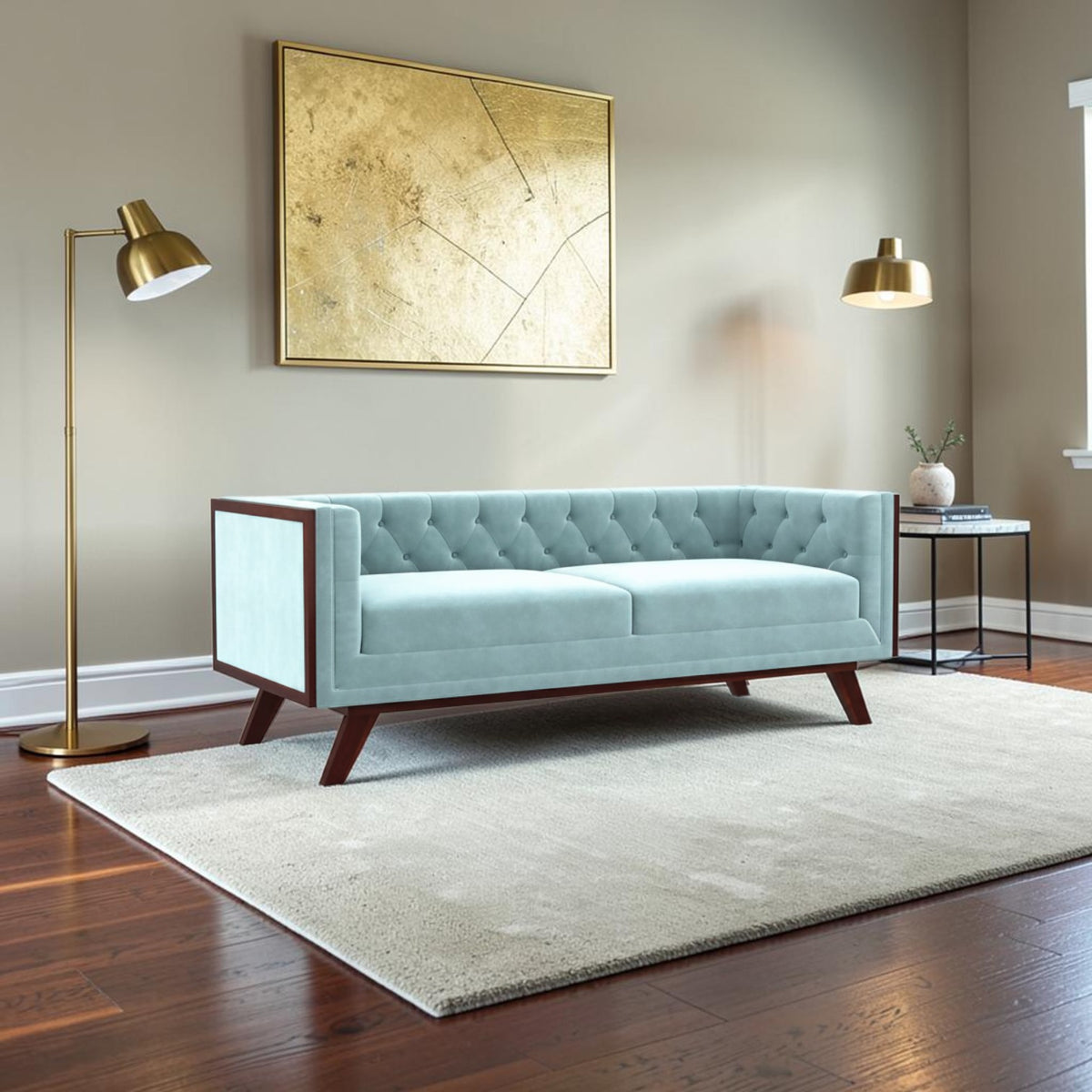 Homecrest Sturton velvet Chesterfield sofa in light blue with a dark wood frame and button-tufted back in a living room.