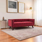 Homecrest Sturton velvet Chesterfield sofa in pomegranate red with tufted backrest and dark wooden frame
