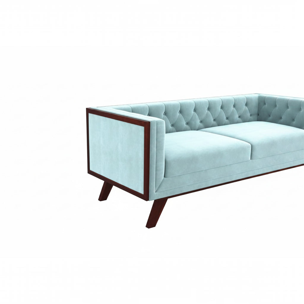 Homecrest Sturton velvet Chesterfield sofa in light blue with button tufting and dark wood frame
