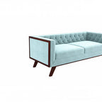 Homecrest Sturton velvet Chesterfield sofa in light blue with button tufting and dark wood frame