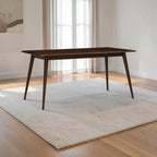Homecrest Tarn rectangular dining table in a dark walnut finish, crafted from solid sheesham wood on a textured rug.