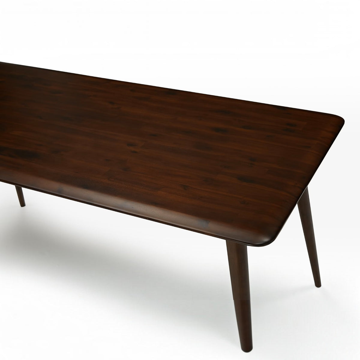 Homecrest Tarn rectangular dining table in a dark walnut finish made from solid sheesham wood with tapered legs.