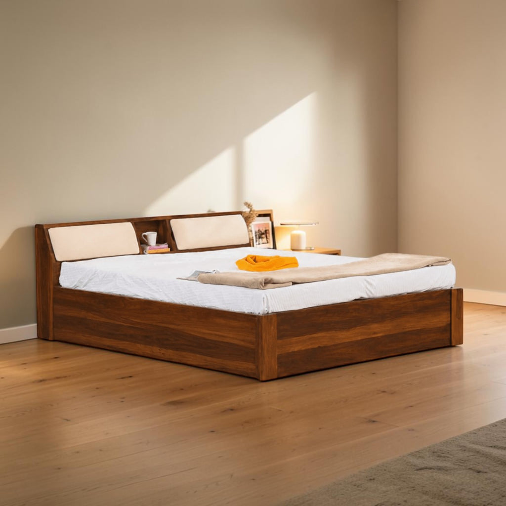 Homecrest Tetbury solid Sheesham wood bed with storage headboard, open shelving, and cushioned backrests in dark teak.