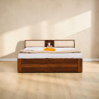 Homecrest Tetbury solid Sheesham wood bed featuring a storage headboard with cushioned backrests in a bedroom setting.