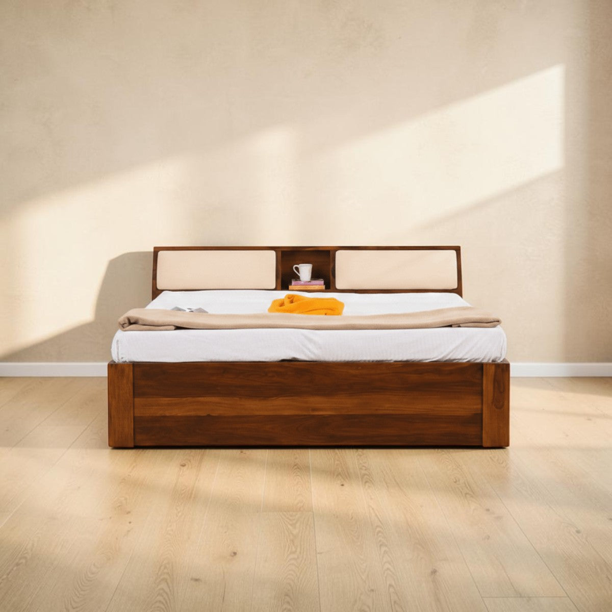 Homecrest Tetbury solid Sheesham wood bed featuring a storage headboard with cushioned backrests in a bedroom setting.