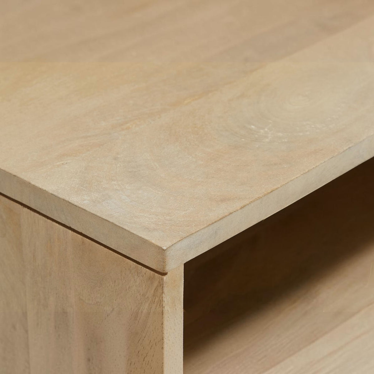 Homecrest Thayer media stand featuring a smooth natural finish mango wood surface and rattan detailing