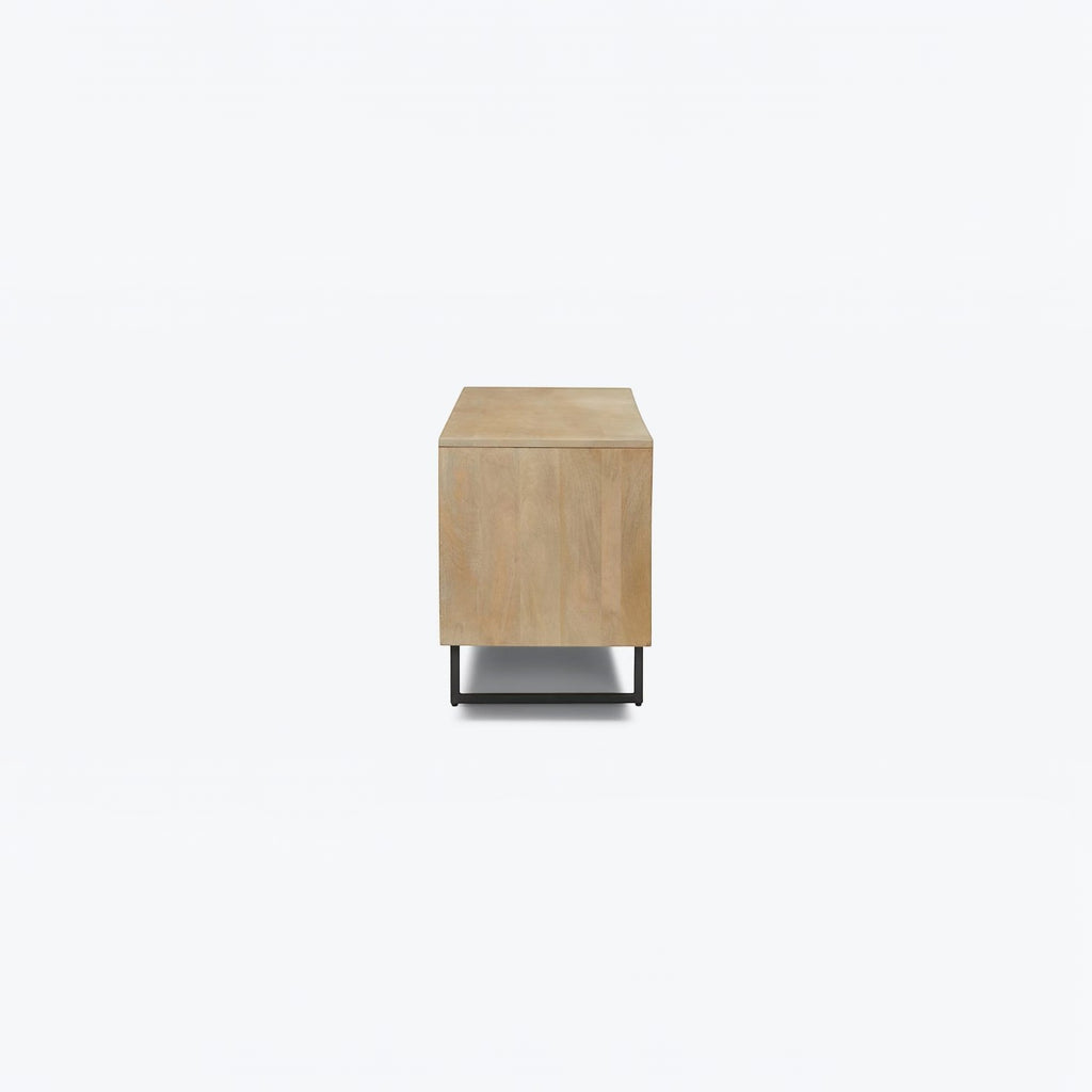 Homecrest Thayer media stand in natural mango wood with rattan detailing and black metal base, side view.