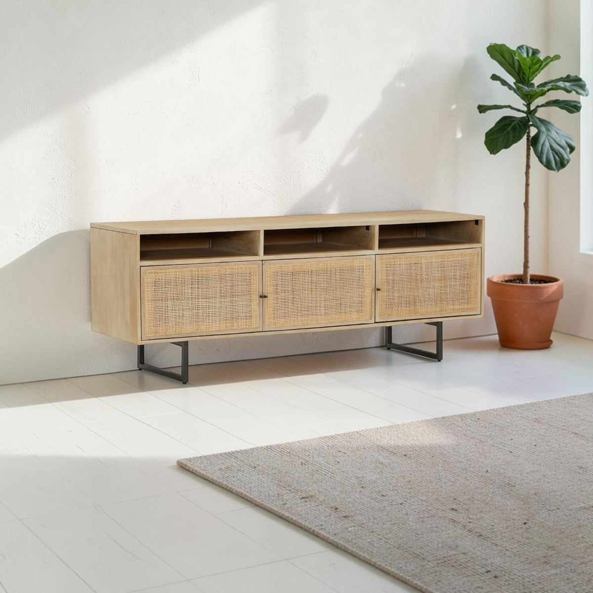 Homecrest Thayer media stand in natural mango wood with rattan door detailing and black metal legs