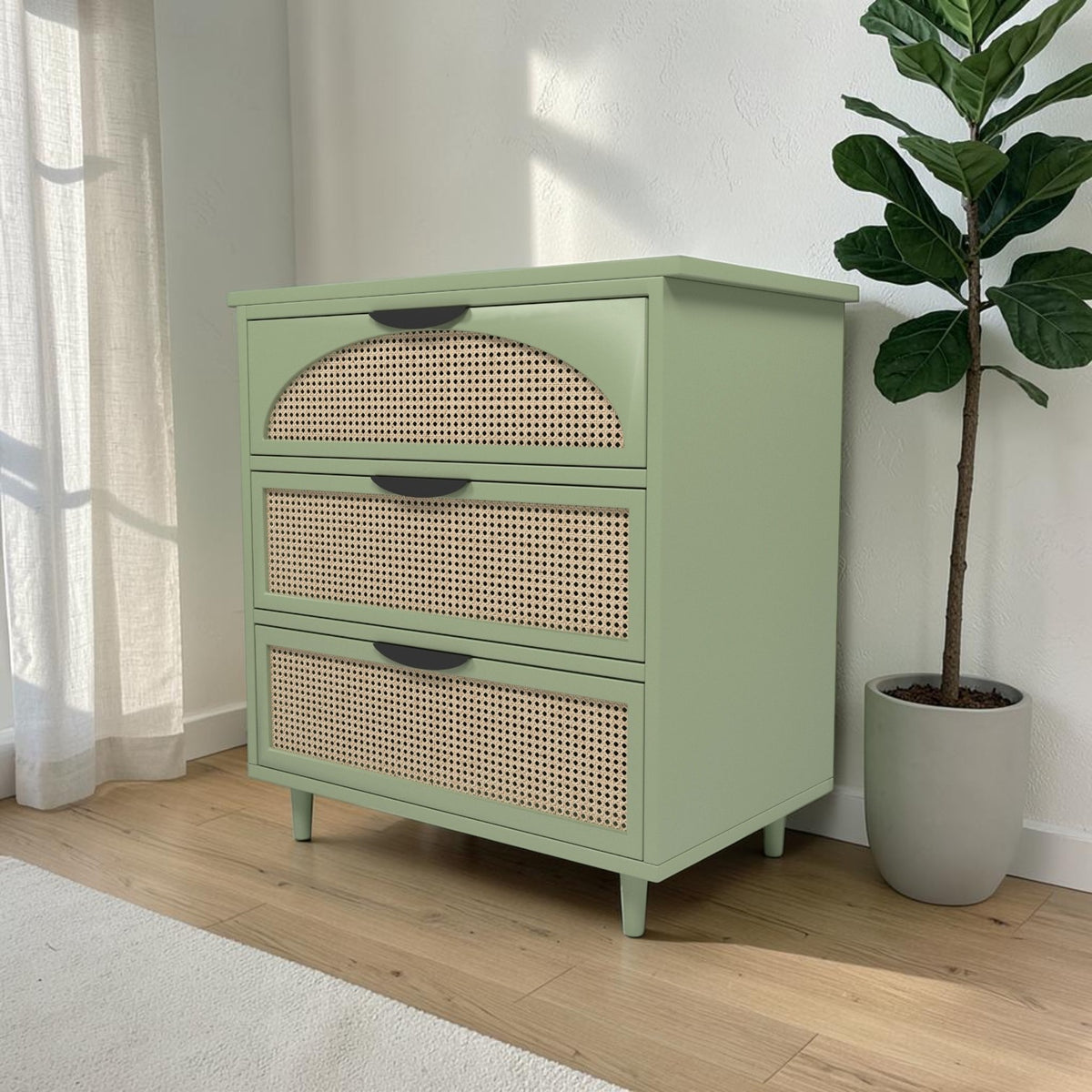 Homecrest Thea chest in Candid Green with cut-out rattan drawer fronts and tapered legs in a bright living room.