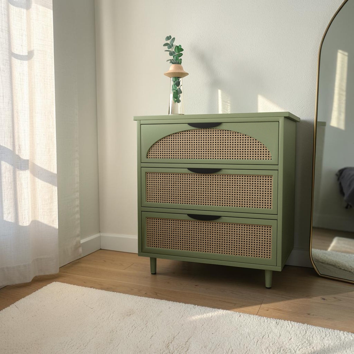 Homecrest Thea chest in Candid Green featuring cut-out rattan drawer fronts and small tapered legs.
