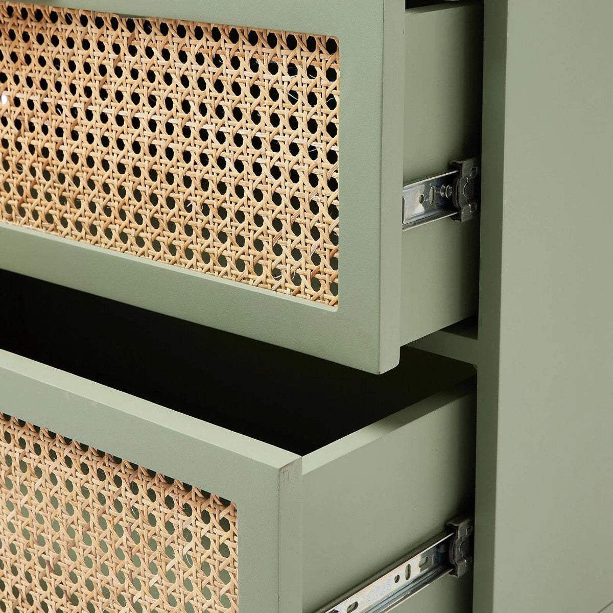Homecrest Thea colour-block chest with sage green frame and natural cut-out rattan drawer fronts, side view.