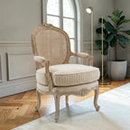Homecrest Thakeham armchair with a beige fabric seat and a carved teak wood frame featuring a rattan backrest.