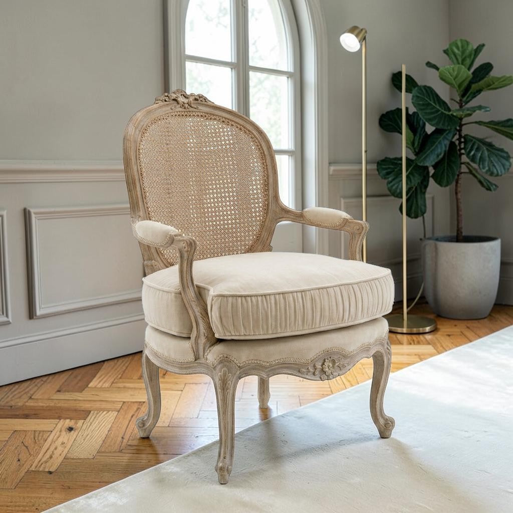 Homecrest Thakeham armchair with a beige fabric seat and a carved teak wood frame featuring a rattan backrest.