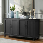 Homecrest Thorne four-door black sideboard made of solid sheesham wood with vertical panel detailing and low legs.