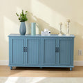Homecrest Thorne four-door sideboard in blue sheesham wood with vertical paneling and black hardware