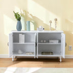 Homecrest Thorne four-door white wooden sideboard with open doors revealing internal shelving against a yellow wall