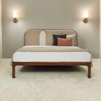 Homecrest Ufton Art Deco teakwood bed featuring a sand-colored boucle upholstered headboard in a modern bedroom.