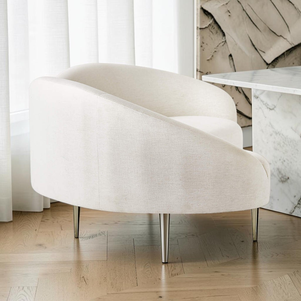 Homecrest Vernham white poly linen three-seater sofa seen from the rear, showing the upholstered outside of the curved back, with sleek metal legs in a modern living room setting