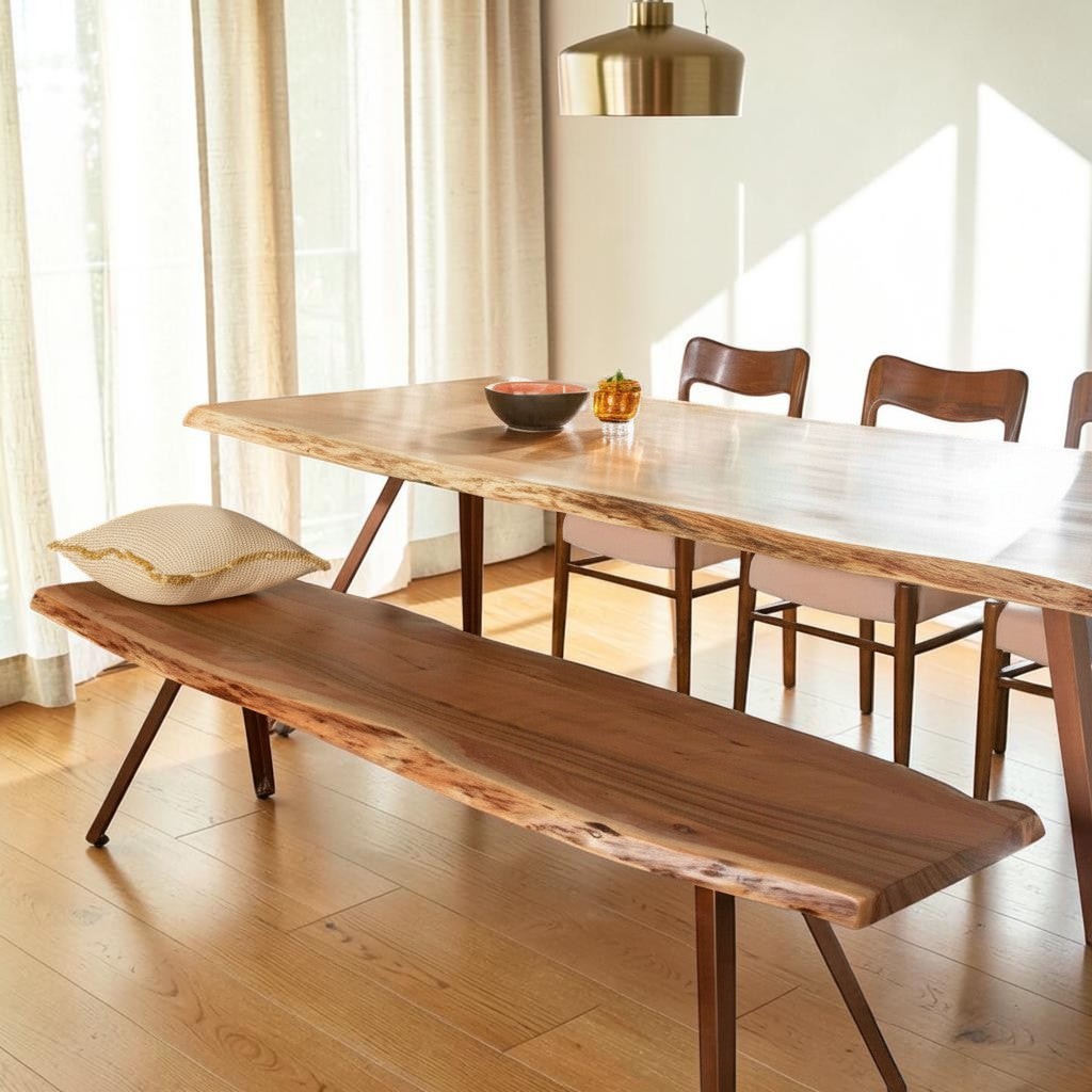 Homecrest Verdon live edge acacia wood dining table and matching bench with metal legs in a bright dining room
