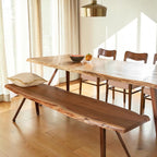 Homecrest Verdon live edge acacia wood dining table and matching bench with metal legs in a bright dining room