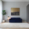 Homecrest Verity navy blue polyester three-seater sofa bed in a modern living room with a white rug and wall art.