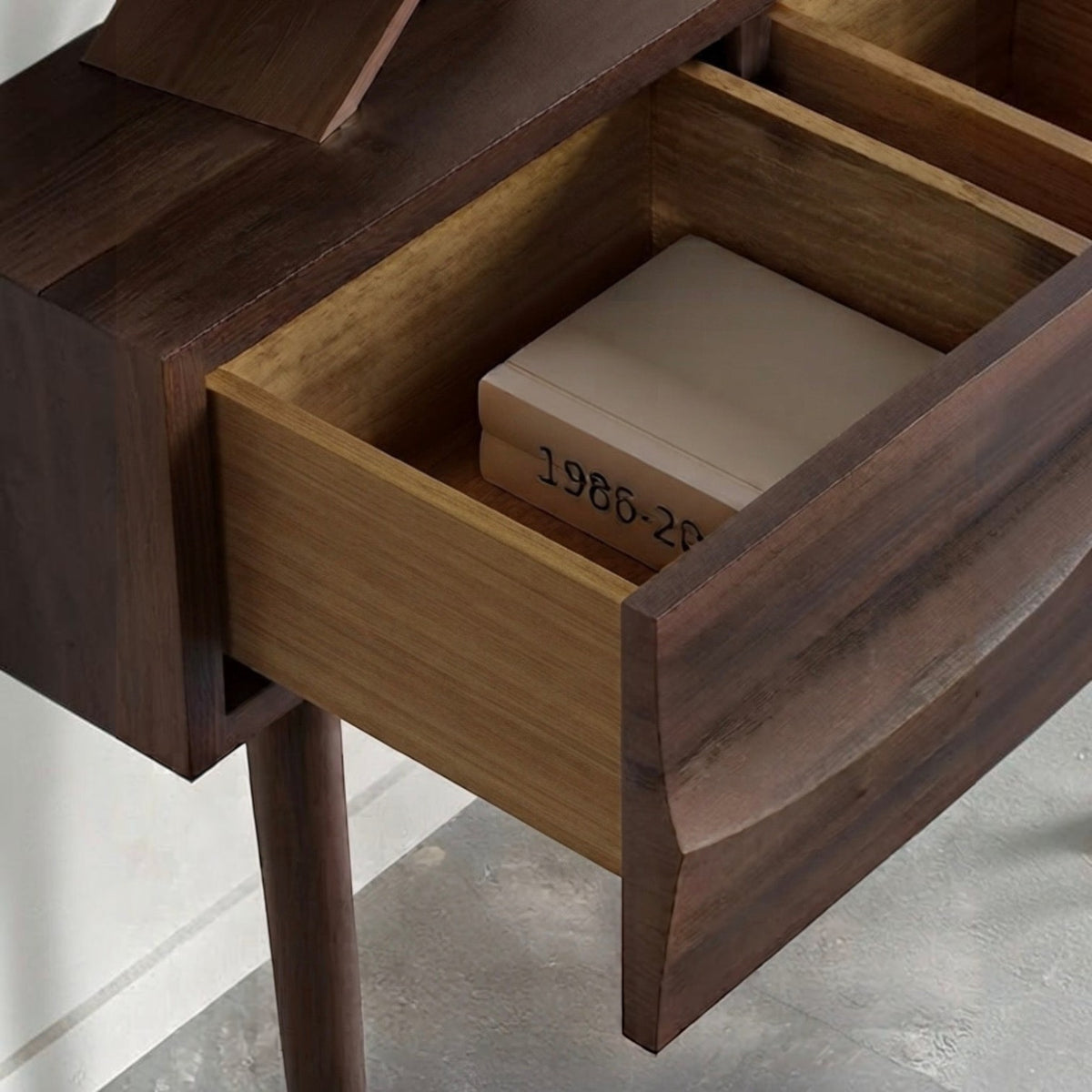 Homecrest Vessa console table in walnut finish acacia wood with a carved wave-patterned open drawer