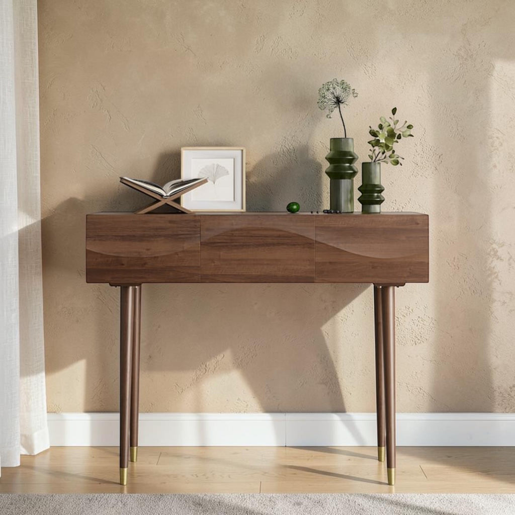 Homecrest Vessa console table in walnut finish acacia wood with carved wave-patterned drawer fronts and tapered legs.