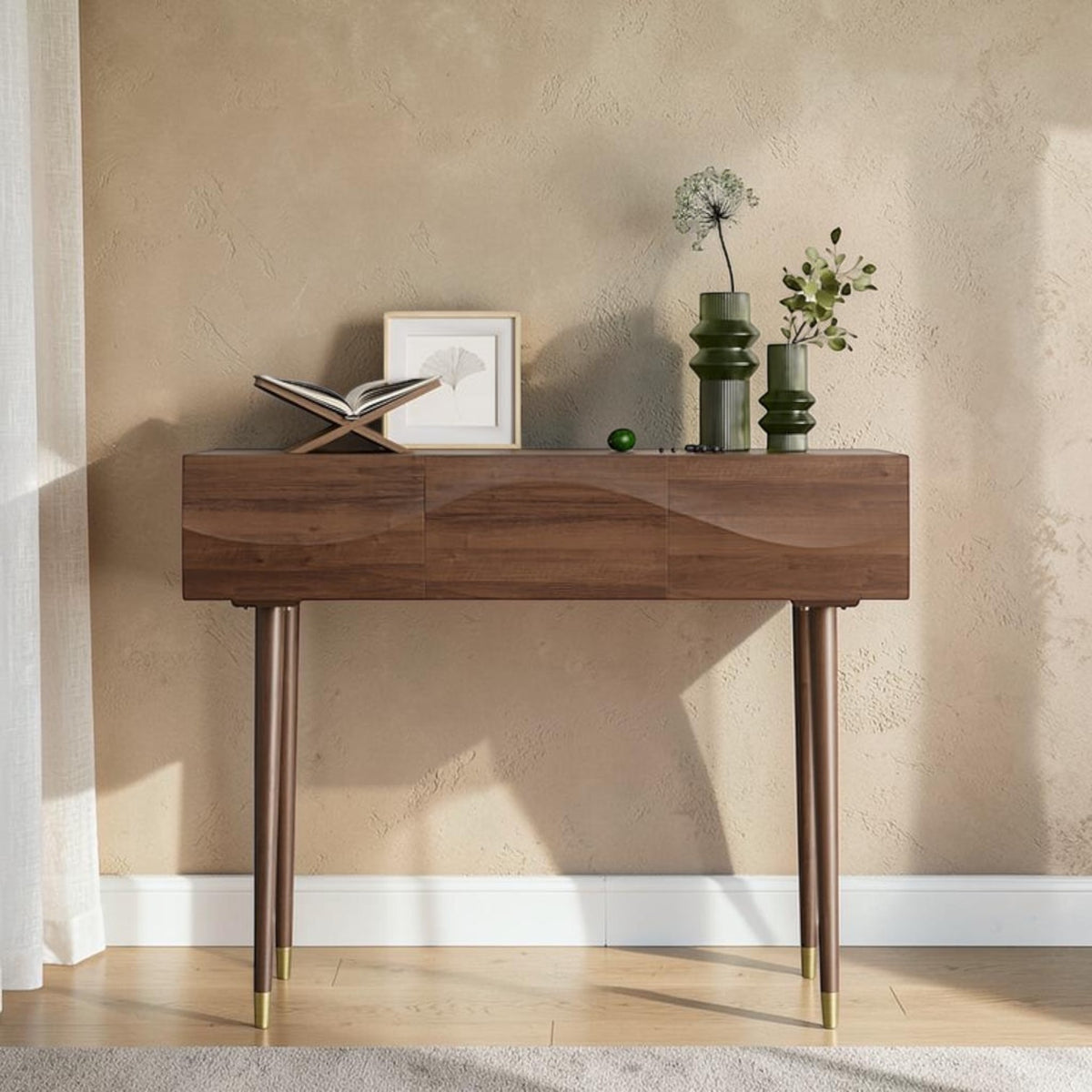 Homecrest Vessa console table in walnut finish acacia wood with carved wave-patterned drawer fronts and tapered legs.