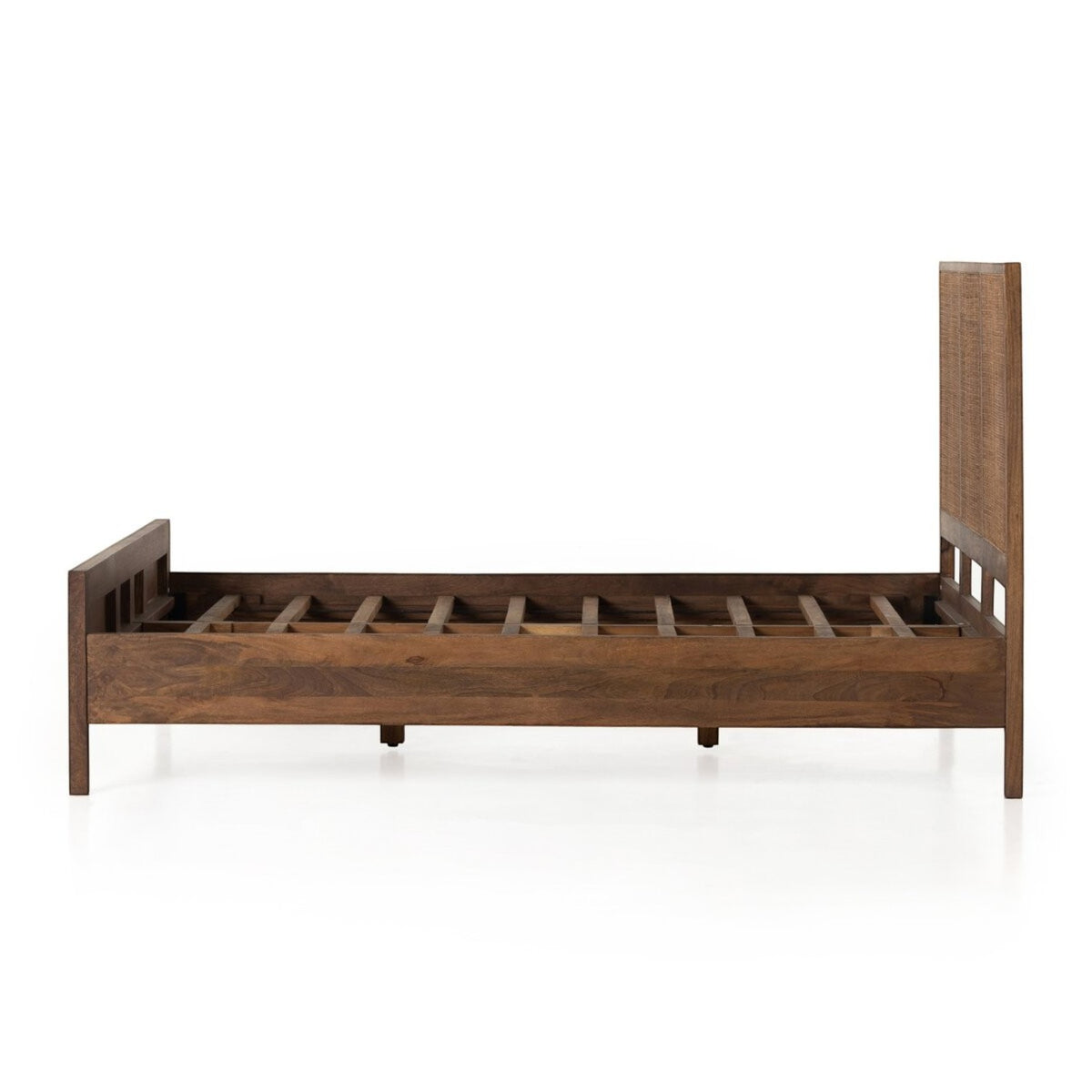Homecrest walnut mango wood bed frame with a woven rattan headboard, side view showing sturdy wooden slats.