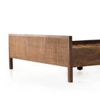 Homecrest walnut mango wood bed frame featuring a three-panel woven rattan headboard in a natural finish.