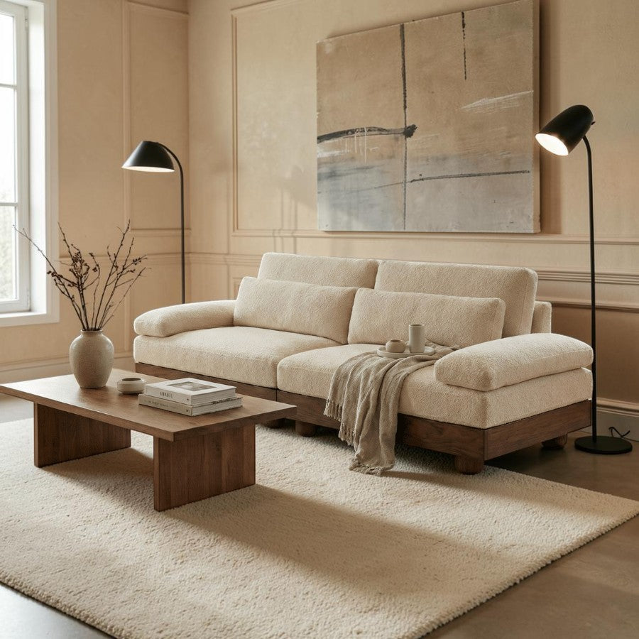 Homecrest Draycott solid wood sofa with cream plush fabric upholstery and deep cushions in a modern living room