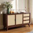 Homecrest Whitlock walnut sideboard with rattan door and drawer fronts, standing on tall tapered legs in a living room.