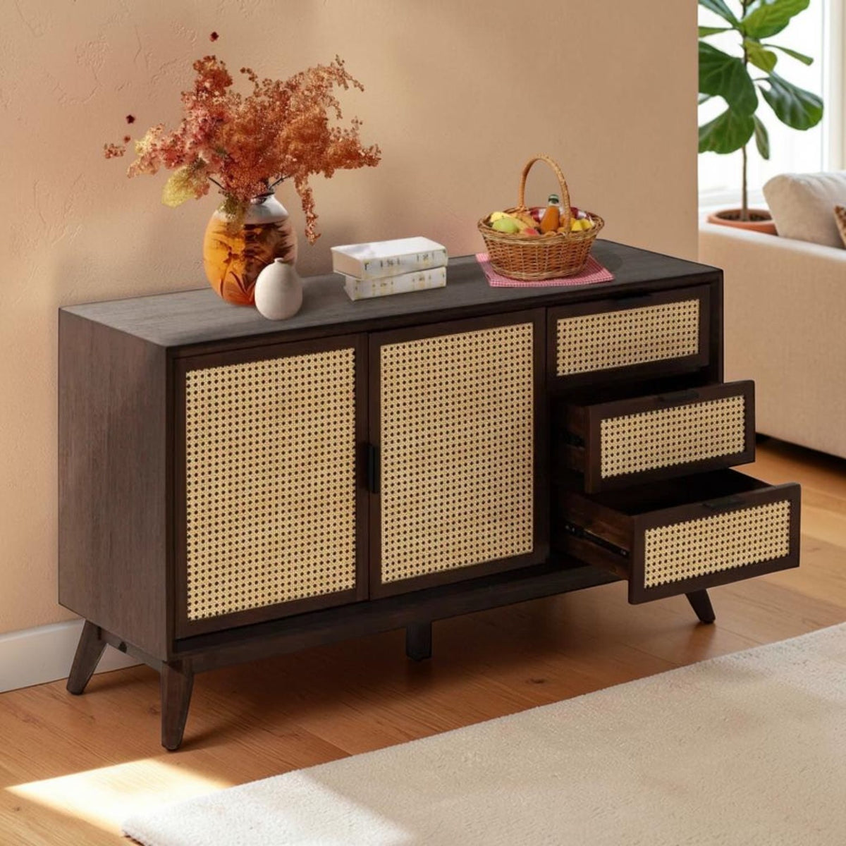 Homecrest Whitlock sideboard in walnut acacia wood with natural rattan door and drawer fronts on tall tapered legs.