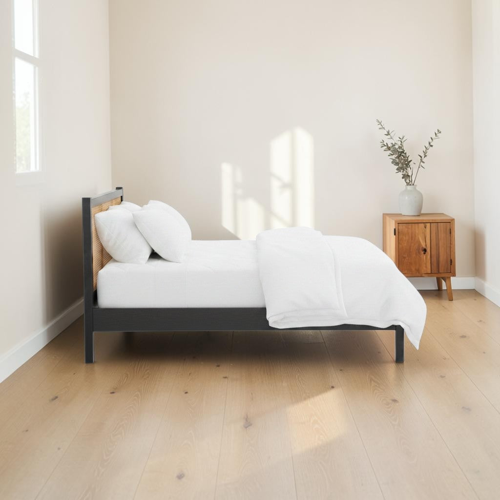 Homecrest Wicker solid mango wood bed frame with a natural handwoven rattan headboard in a minimalist bedroom