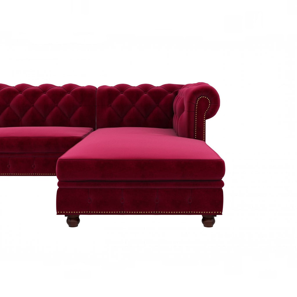 Homecrest Wardour L-shaped velvet Chesterfield sofa in burgundy with tufted back and brass nailhead trim.