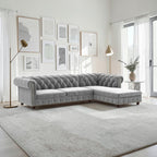 Homecrest Wardour L-shaped grey velvet Chesterfield sofa with button tufting and nailhead trim in a bright living room
