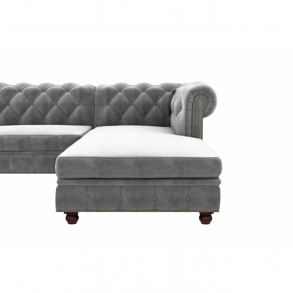 Homecrest Wardour L-shaped grey velvet Chesterfield sofa with tufted backrest and brass nailhead trim