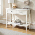 Homecrest Winsley white console table made of sheesham wood with carved legs, two drawers, and a lower display shelf.