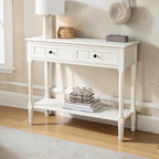 Homecrest Winsley white console table made of sheesham wood with carved legs, two drawers, and a lower display shelf.