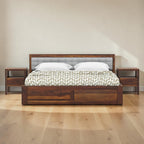 Homecrest Thurloe solid Sheesham wood bed with a grey cushioned headboard and matching wooden nightstands.