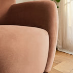 Homecrest Yannick accent chair in plush truffle pink velvet with curved wing armrest detail